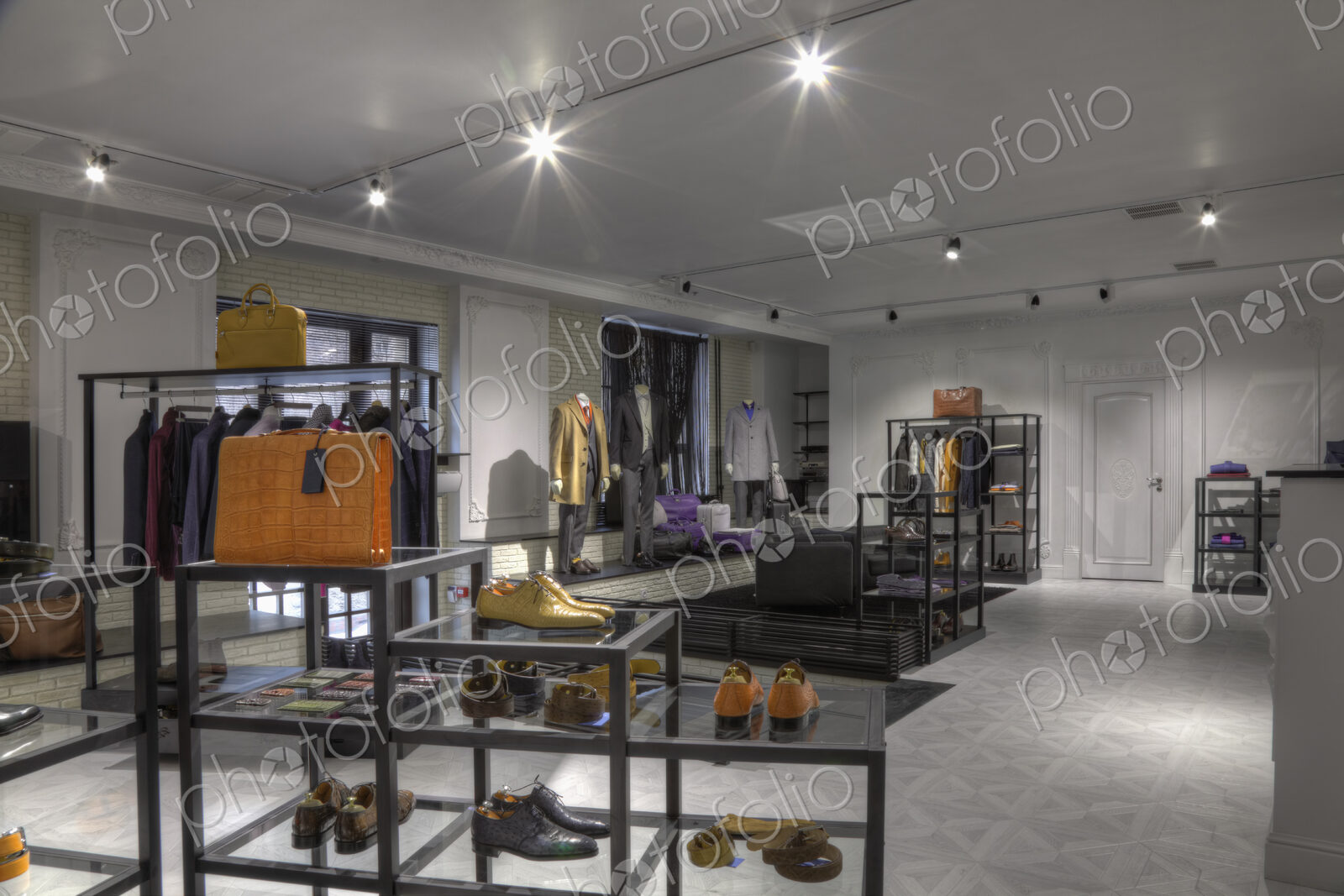 Suits and shoes in clothing store for men