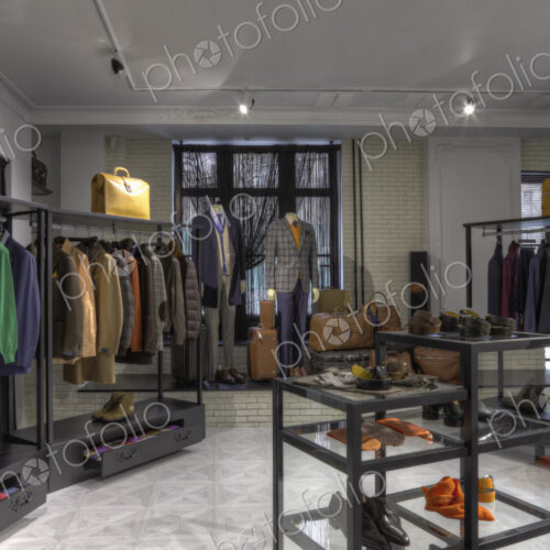 Suits and shoes in clothing store for men Suits and shoes in clothing store for men
