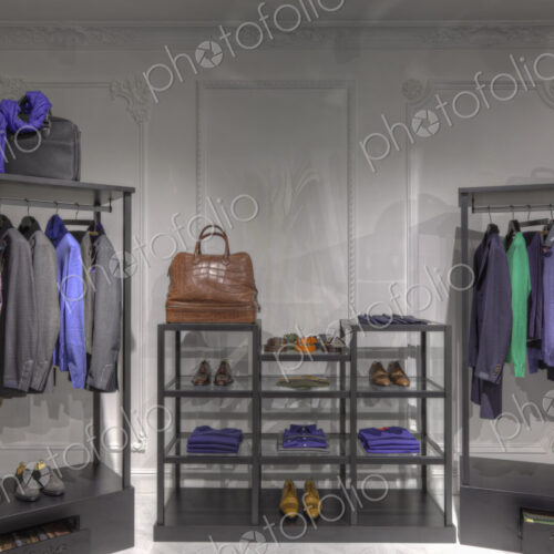 Suits and shoes in clothing store for men Suits and shoes in clothing store for men
