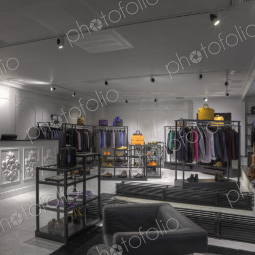 Suits and shoes in clothing store for men Suits and shoes in clothing store for men