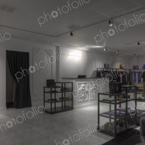Suits and shoes in clothing store for men Suits and shoes in clothing store for men
