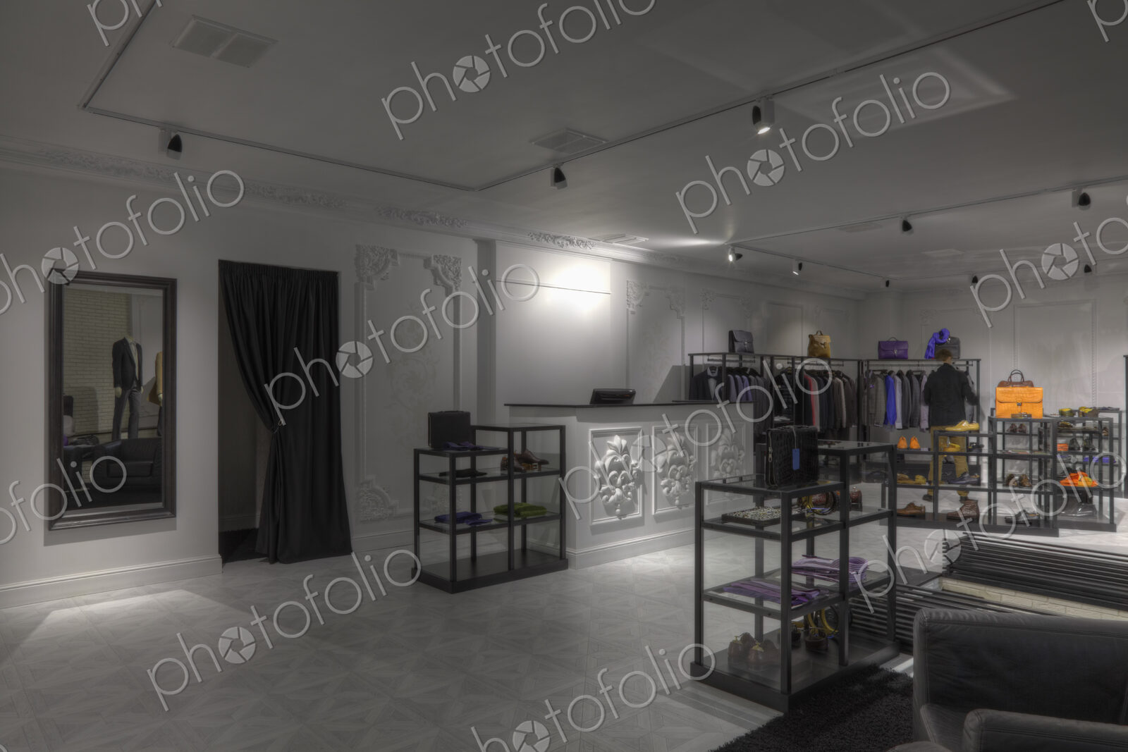 Suits and shoes in clothing store for men