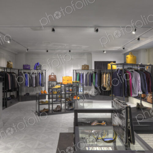 Suits and shoes in clothing store for men Suits and shoes in clothing store for men