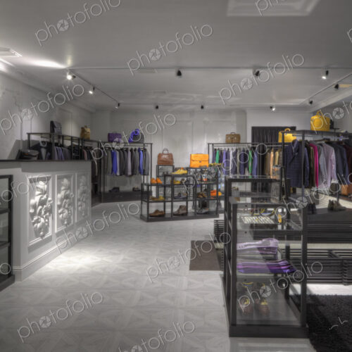 Suits and shoes in clothing store for men Suits and shoes in clothing store for men
