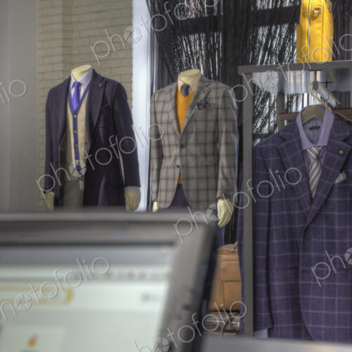 Suits and shoes near cash register in clothing store Suits and shoes near cash register in clothing store
