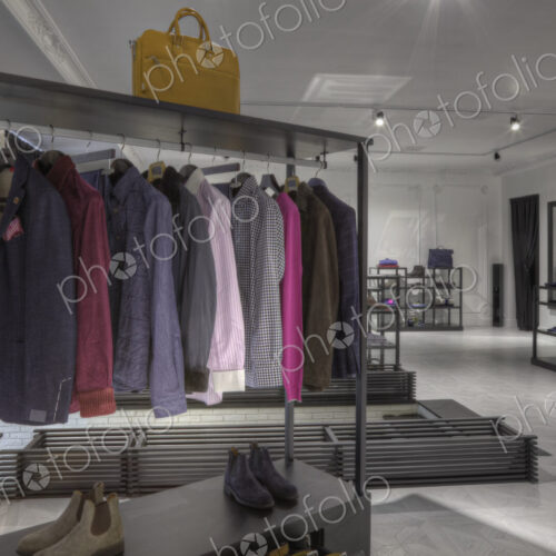 Suits and shoes on rack in clothing store for men Suits and shoes on rack in clothing store for men
