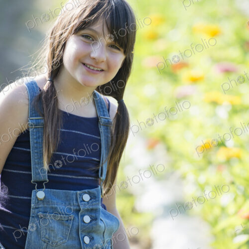 Summer on an organic farm. A young girl in a field of flowers. Summer on an organic farm. A young girl in a field of flowers.