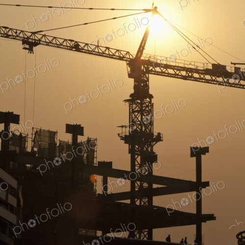 Sun Shining Behind a Construction Crane
