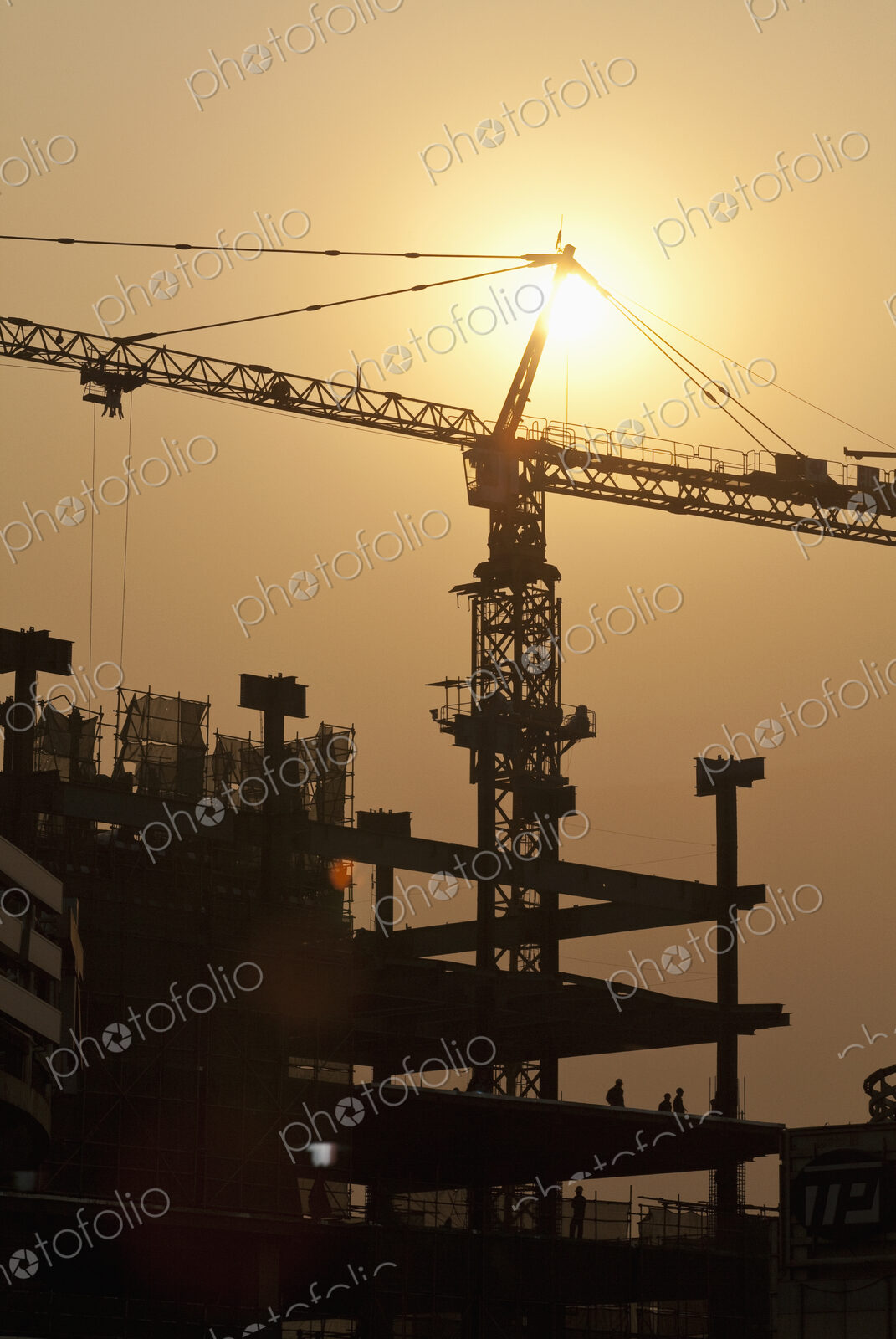 Sun Shining Behind a Construction Crane