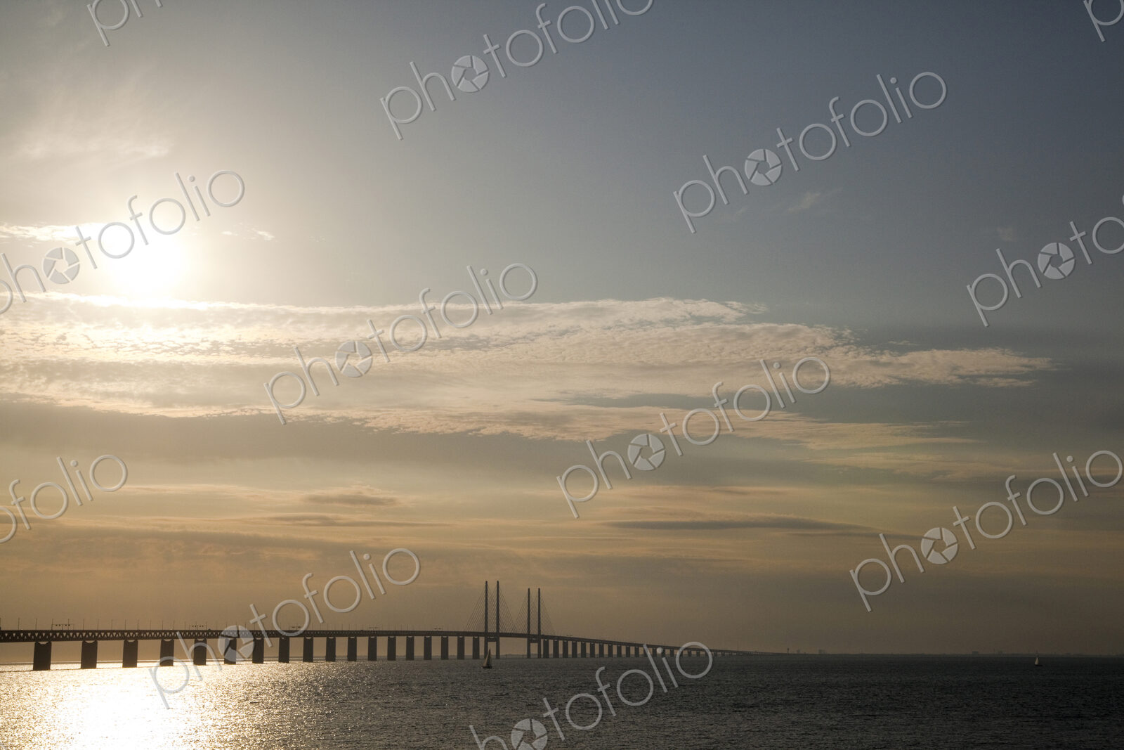 Sun in sky over Oresund Bridge, Malmo, Sweden