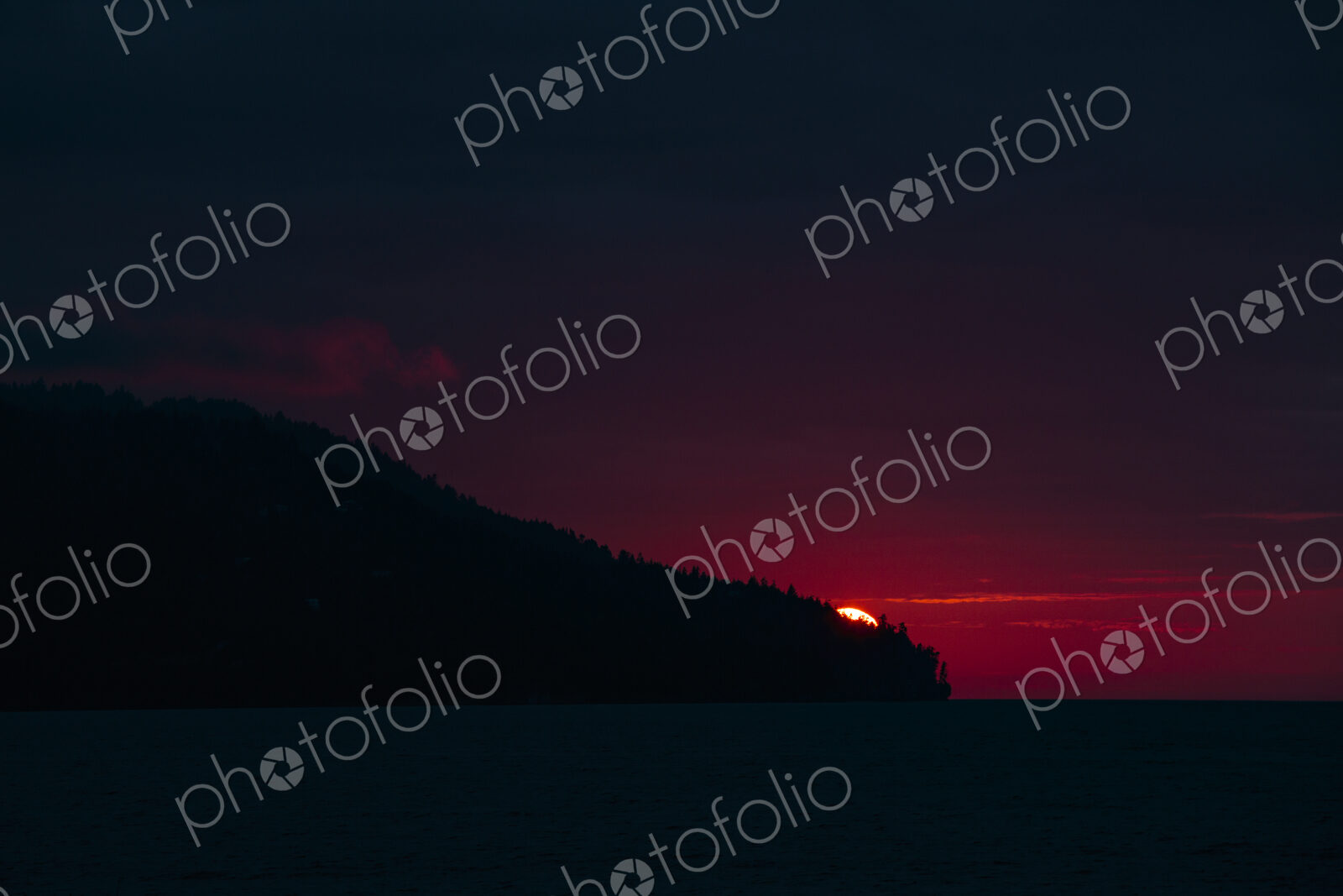 Sun setting over Striped Peak, Port Angeles, WA USA