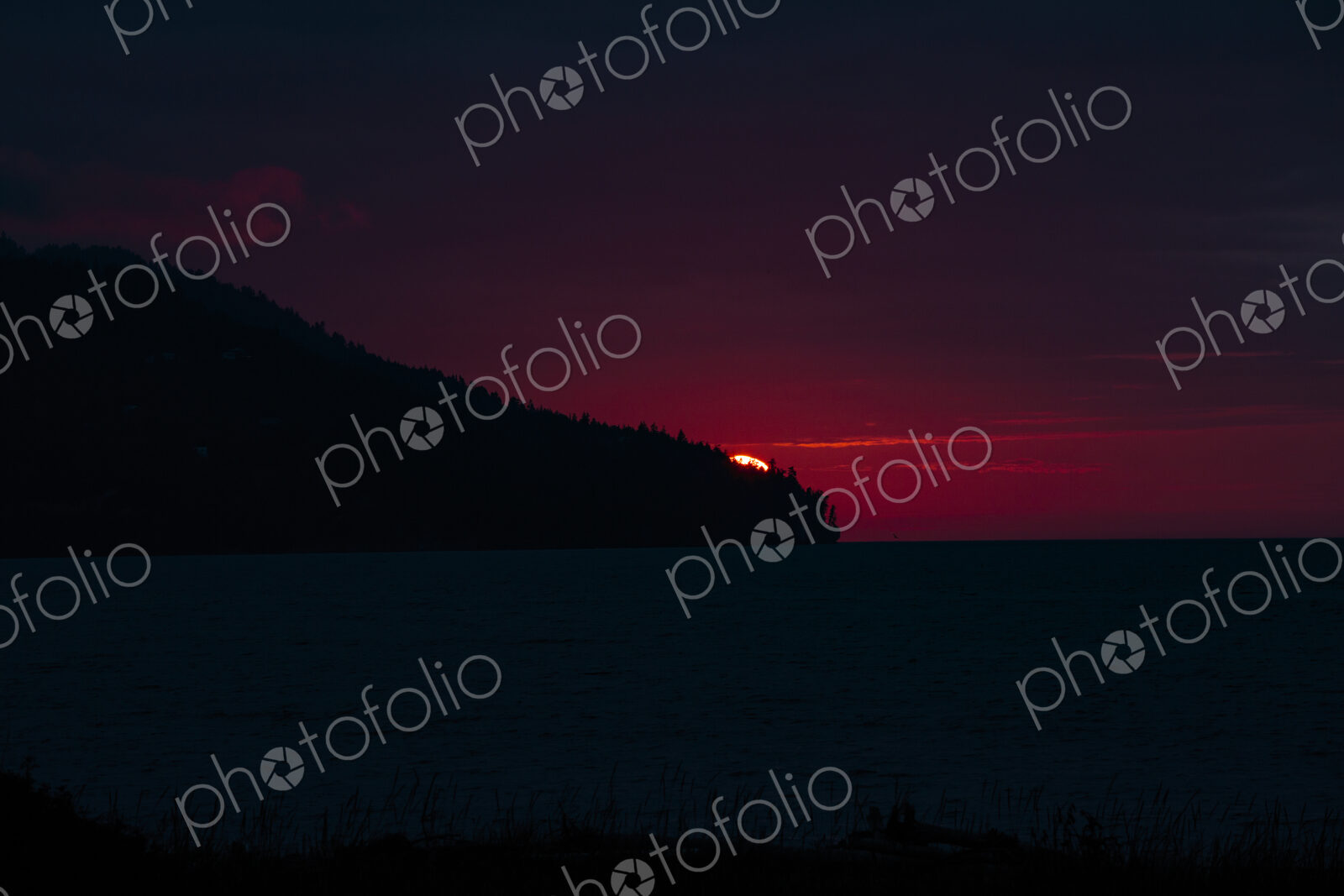 Sun setting over Striped Peak, Port Angeles, WA USA