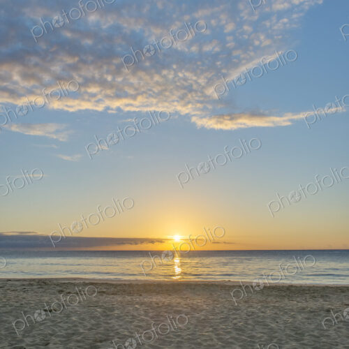 Sun setting over Wailua beach, Kauai.