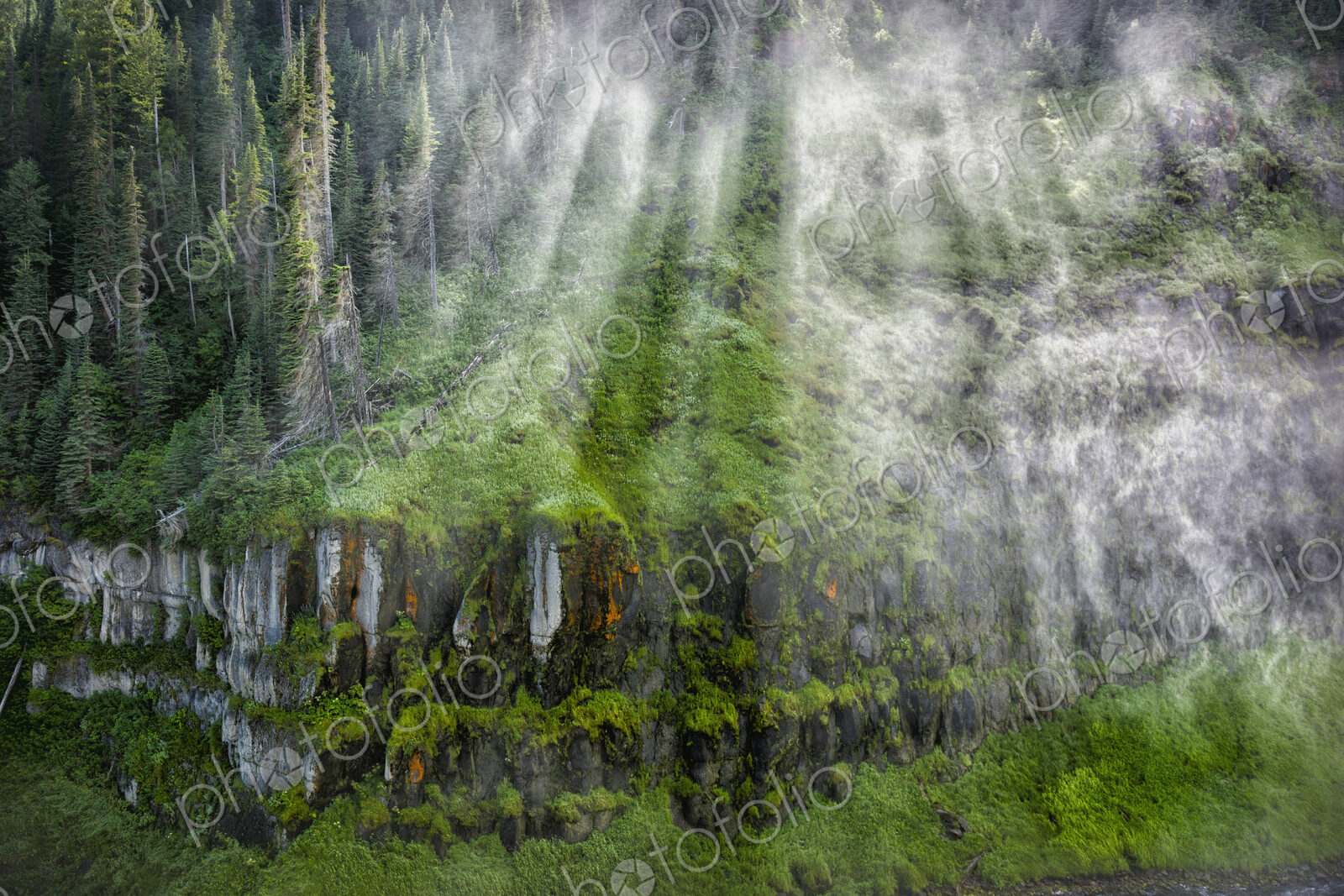 Sunbeams and clouds over remote hillside