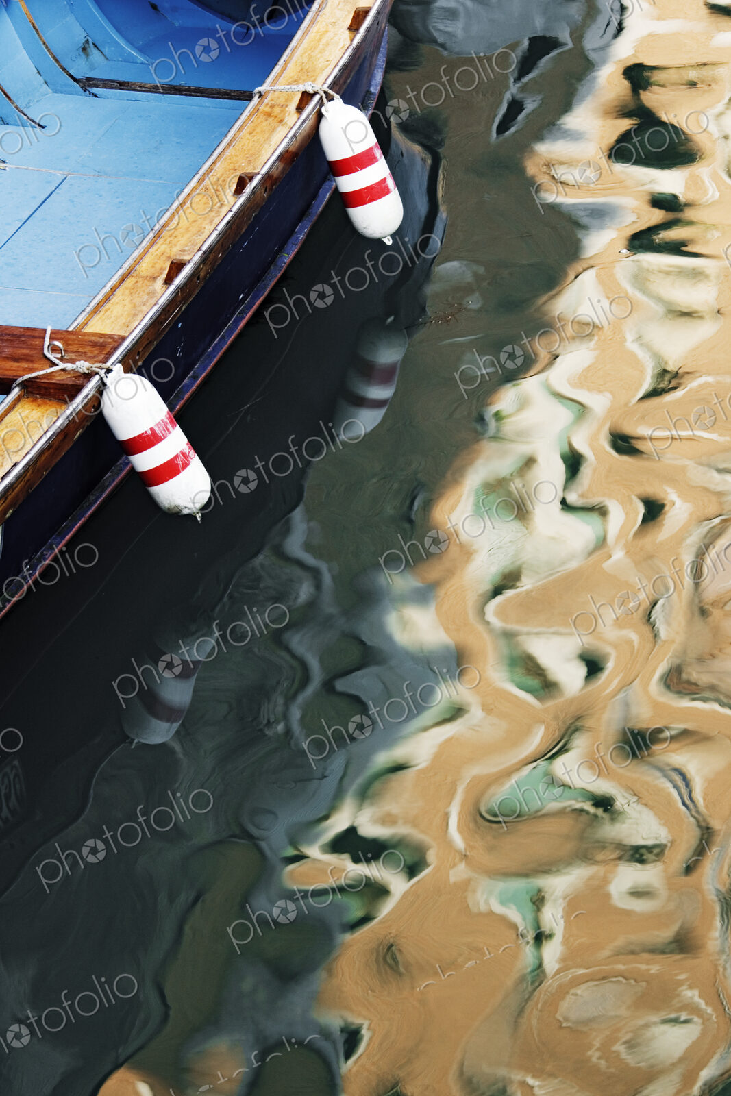Sunlight and Boat Reflected in Canal