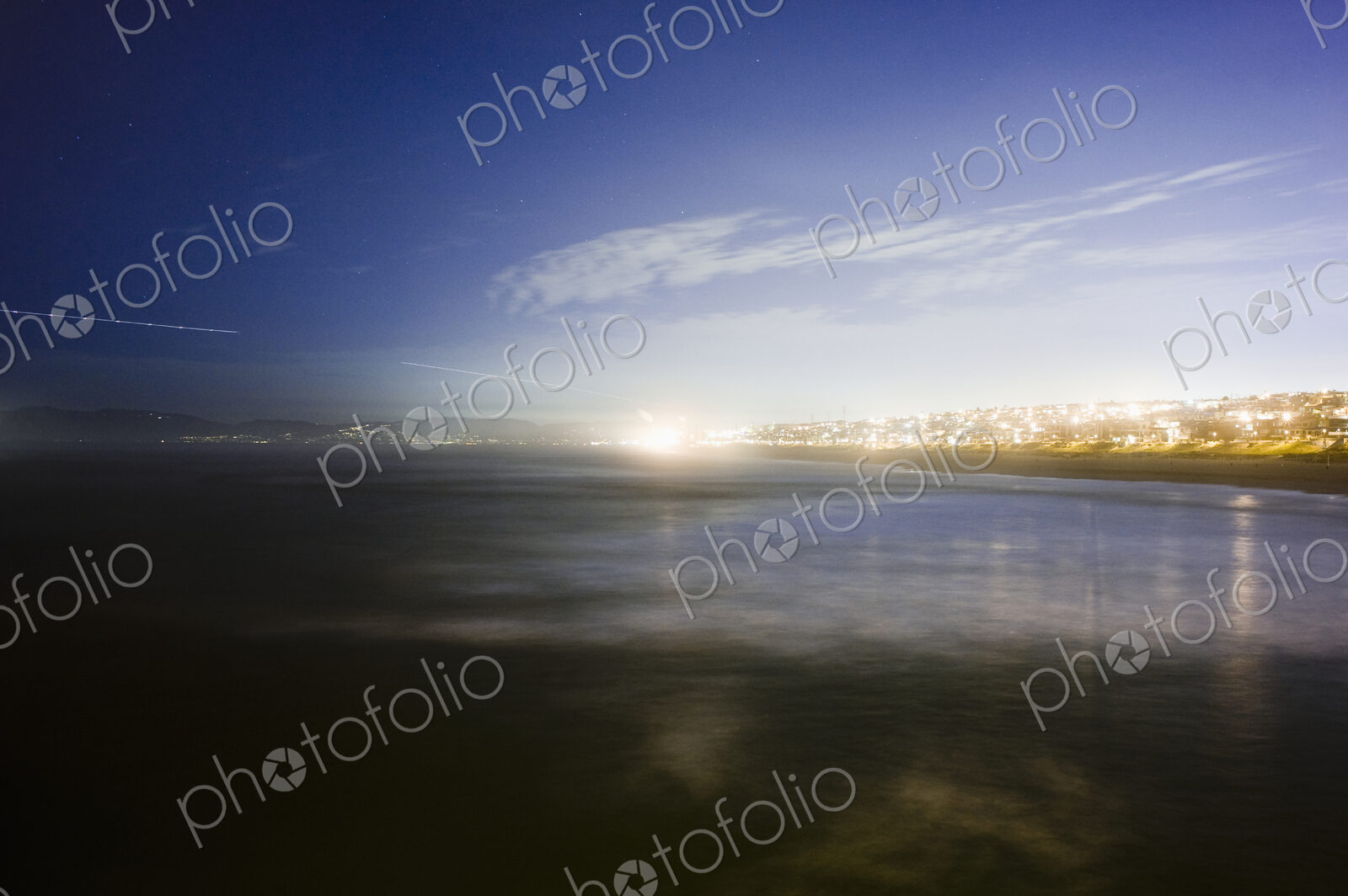 Sunlight on lake in urban area.