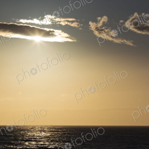 Sunlight over the Strait of Juan de Fuca, lighting up the clouds passing across the sun. Sunlight over the Strait of Juan de Fuca, lighting up the clouds passing across the sun.