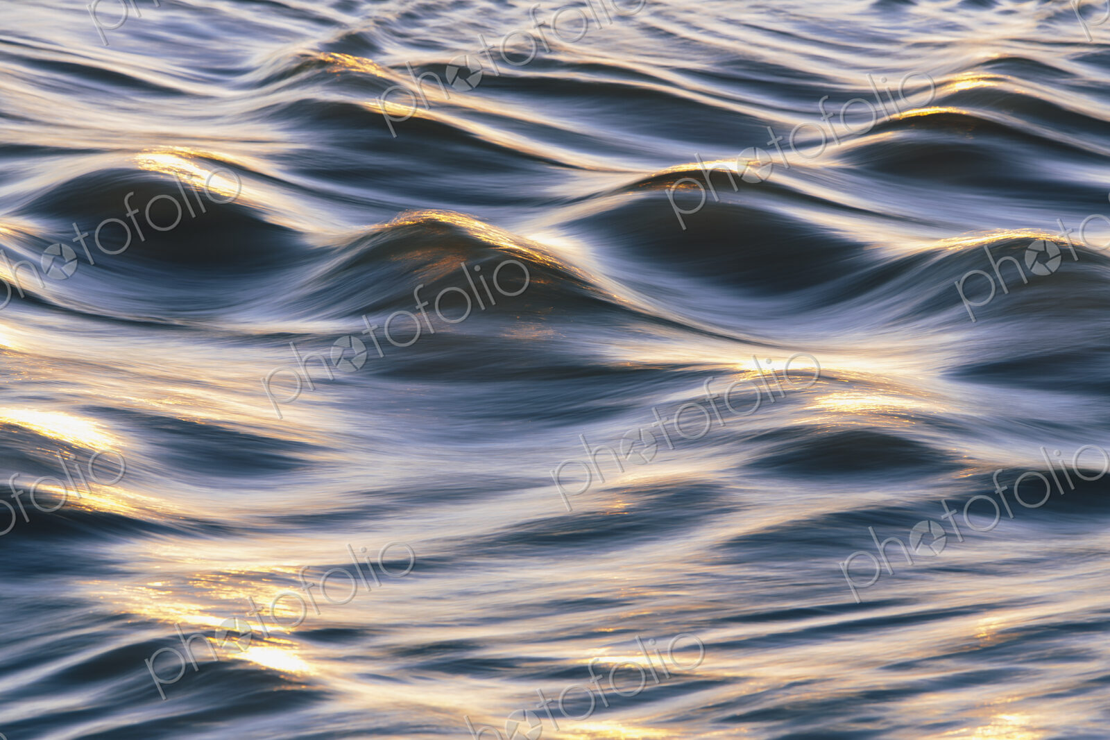 Sunlight reflecting on small waves on the ocean surface.