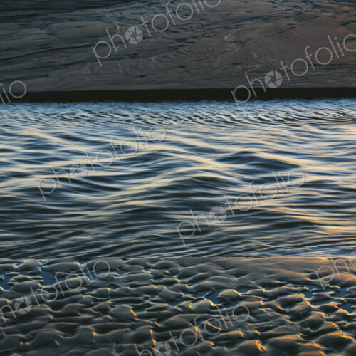 Sunlight reflecting on small waves on the ocean surface.