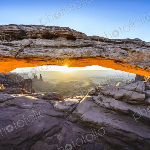 Sunrise at Mesa Arch in Canyonlands National Park at sunrise, the sun lighting the…