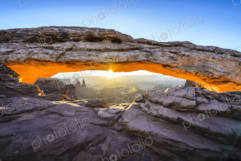 Sunrise at Mesa Arch in Canyonlands National Park at sunrise, the sun lighting the…