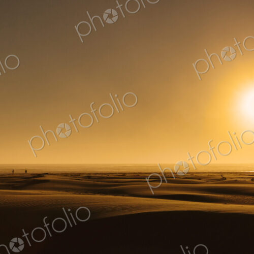 Sunrise over beach sand dunes