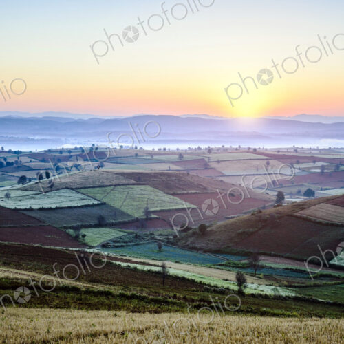 Sunrise over farmland in rural landscape Sunrise over farmland in rural landscape