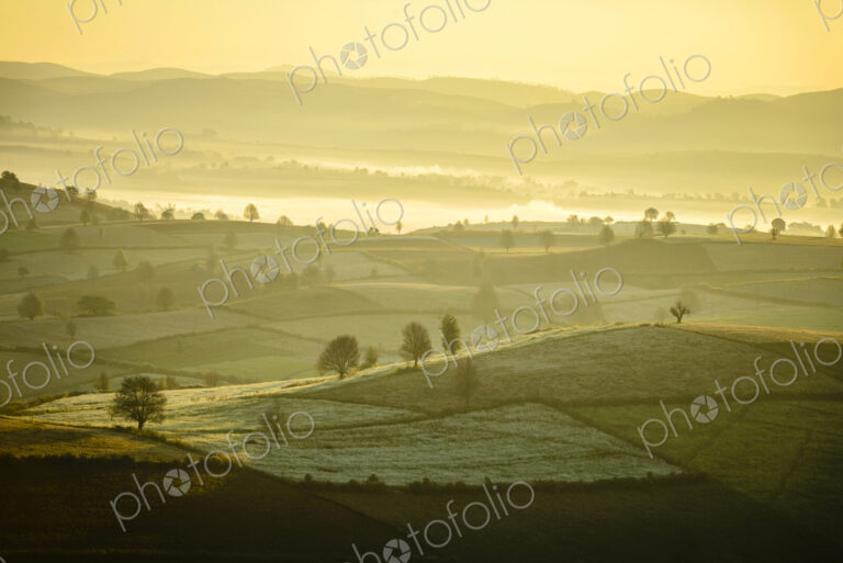 Sunrise over farmland in rural landscape