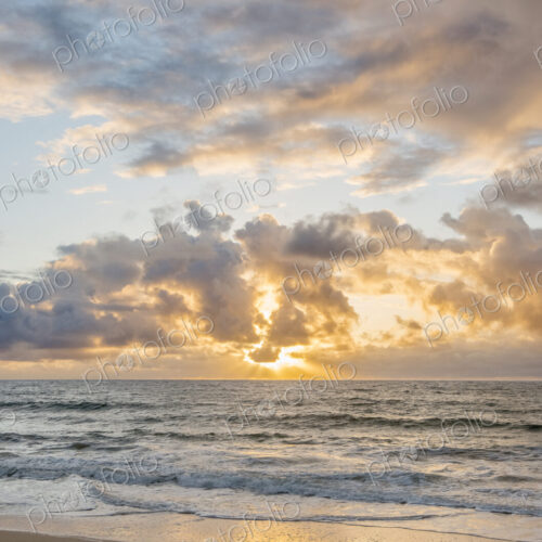 Sunrise over ocean on beach