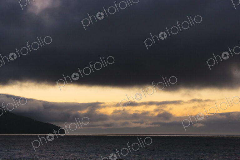 Sunset and dark clouds over the Strait of Juan de Fuca.