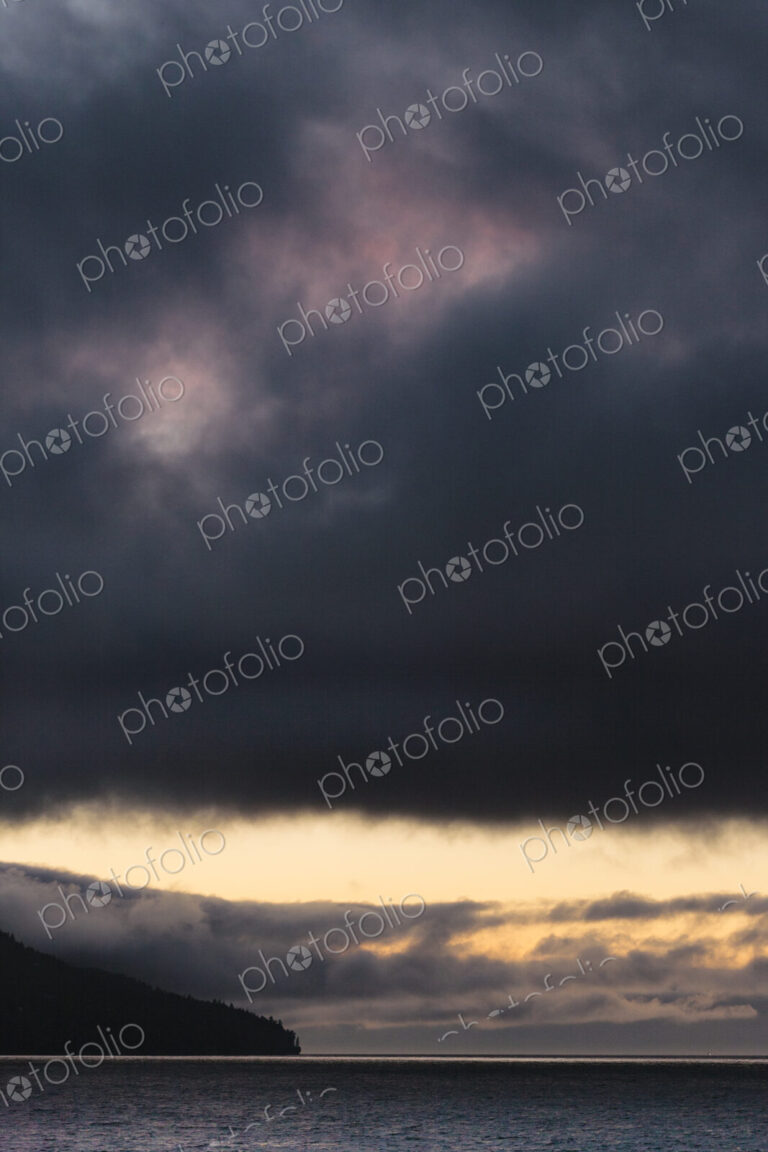 Sunset and dark clouds over the Strait of Juan de Fuca.