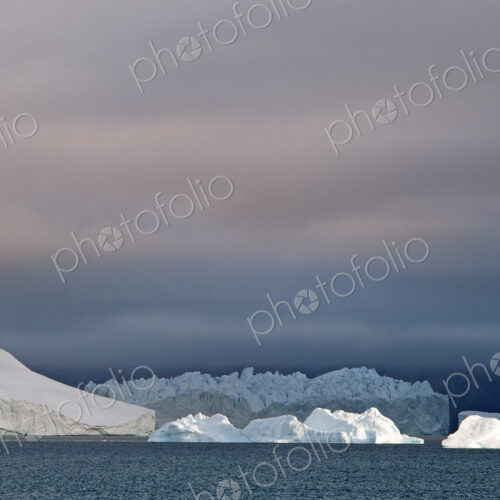 Sunset sky, with heavy cloud and floating icebergs Sunset sky, with heavy cloud and floating icebergs