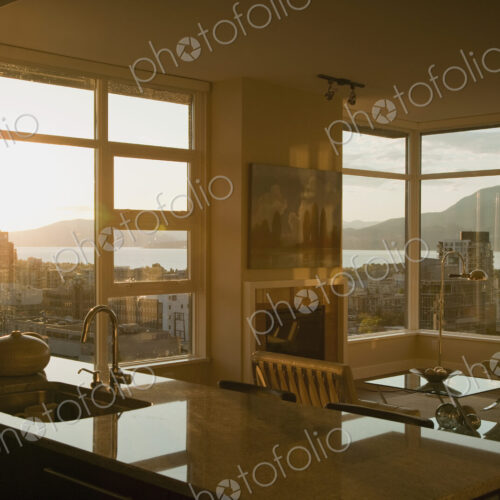 Sunset through windows of open plan apartment. Sunset through windows of open plan apartment.