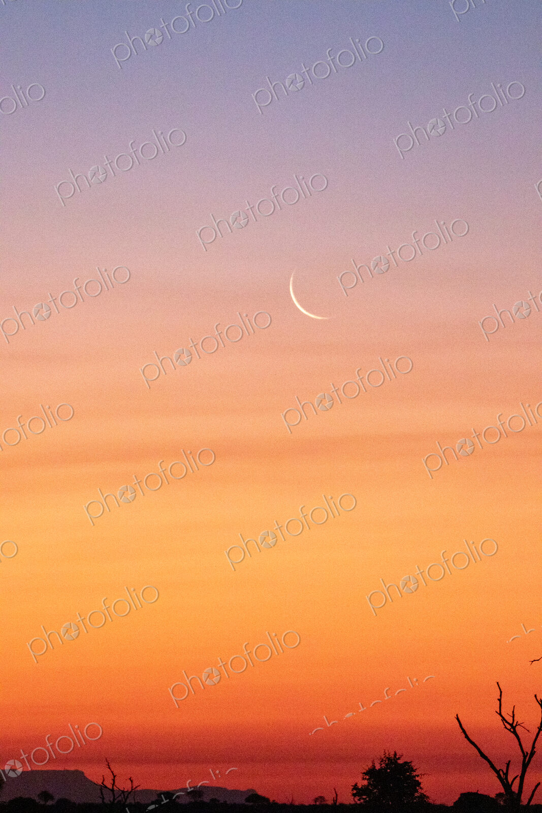 Sunset, with a new moon.