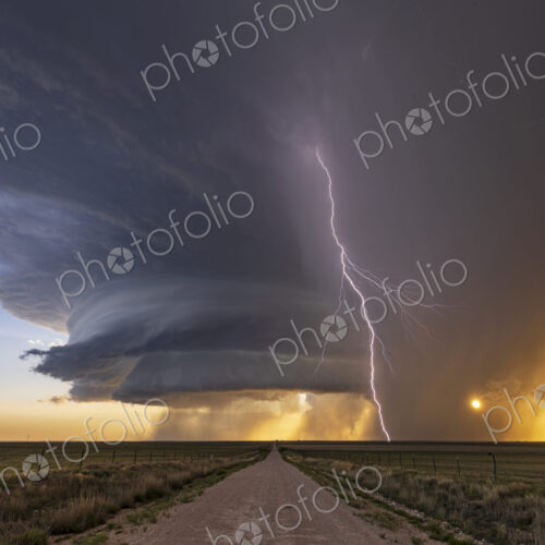 Supercell and Cloud to Ground Lightning at Sunset Supercell and Cloud to Ground Lightning at Sunset