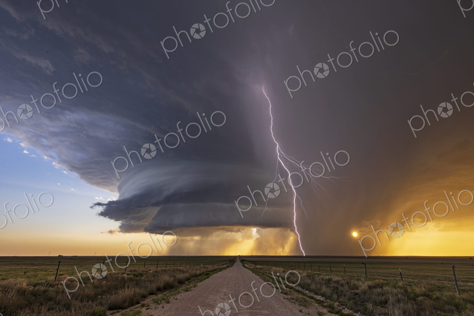 Supercell and Cloud to Ground Lightning at Sunset