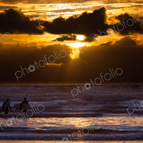 Surfers on Cannon Beach, Oregon, USA Surfers on Cannon Beach, Oregon, USA