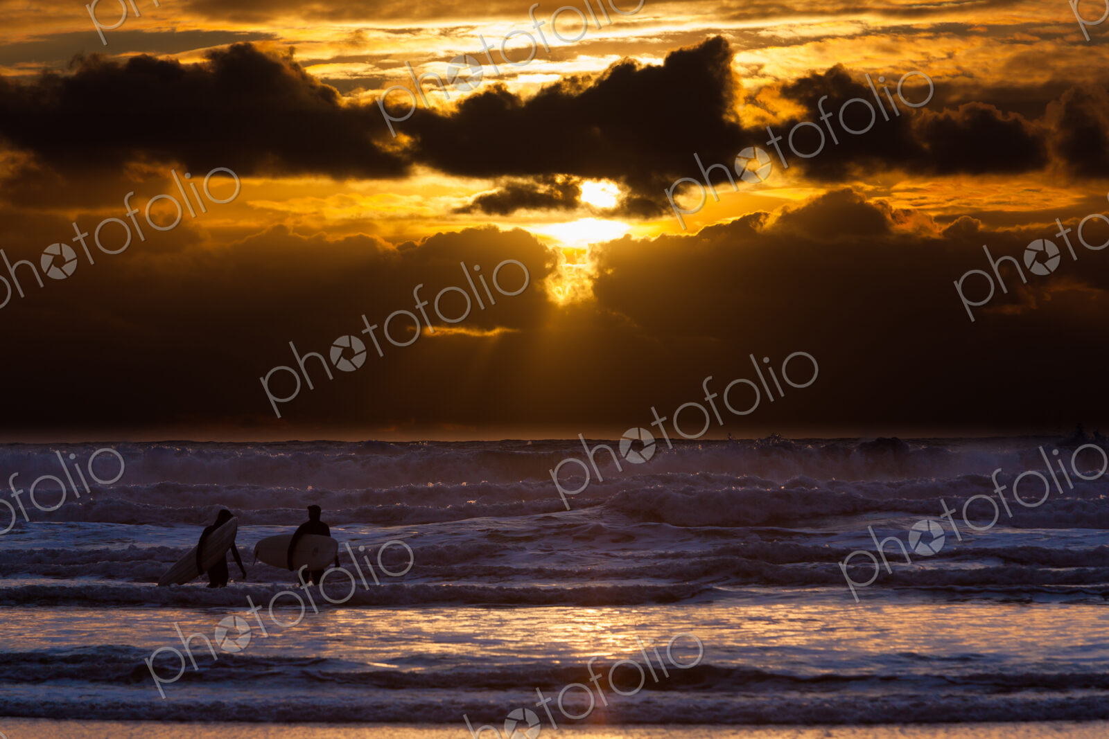 Surfers on Cannon Beach, Oregon, USA