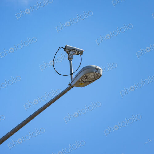 Surveillance security camera mounted on street lamp, USA Surveillance security camera mounted on street lamp, USA