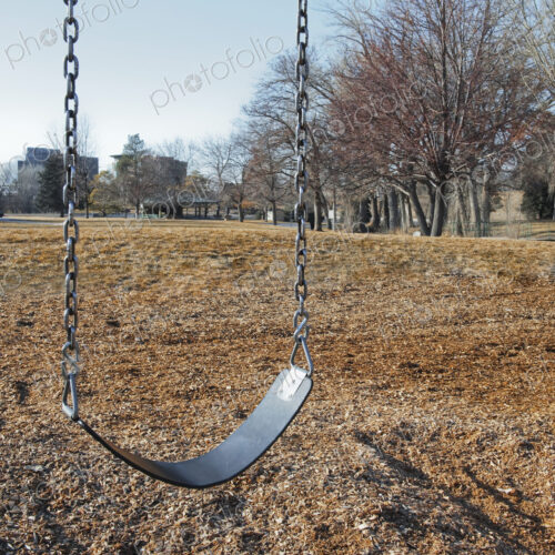 Swing Set on a Grass Field Swing Set on a Grass Field