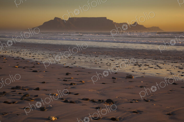 Table Mountain and the outline of Devil's Peak and Lion's Head, viewed from the shores…