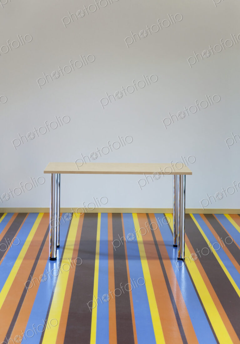Table Standing on a Striped Floor