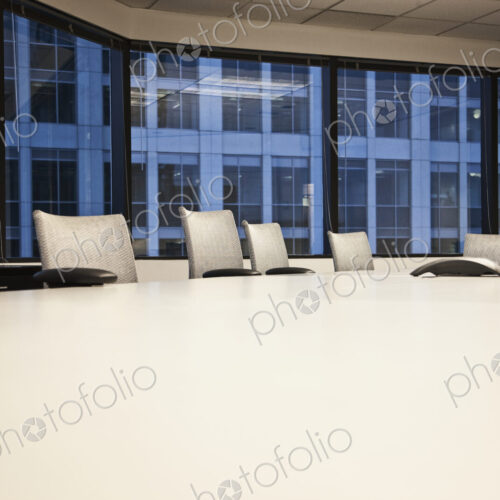 Table and chairs in urban conference room Table and chairs in urban conference room