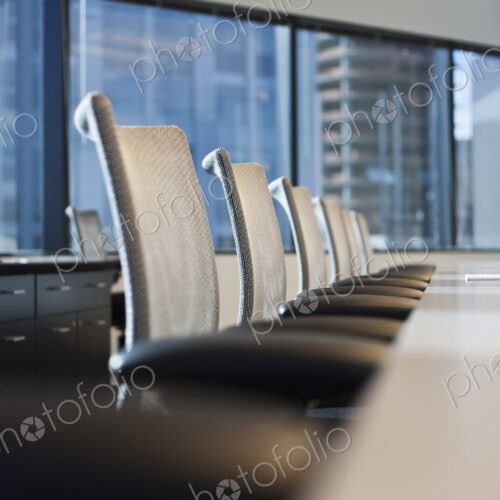 Table and chairs in urban conference room Table and chairs in urban conference room