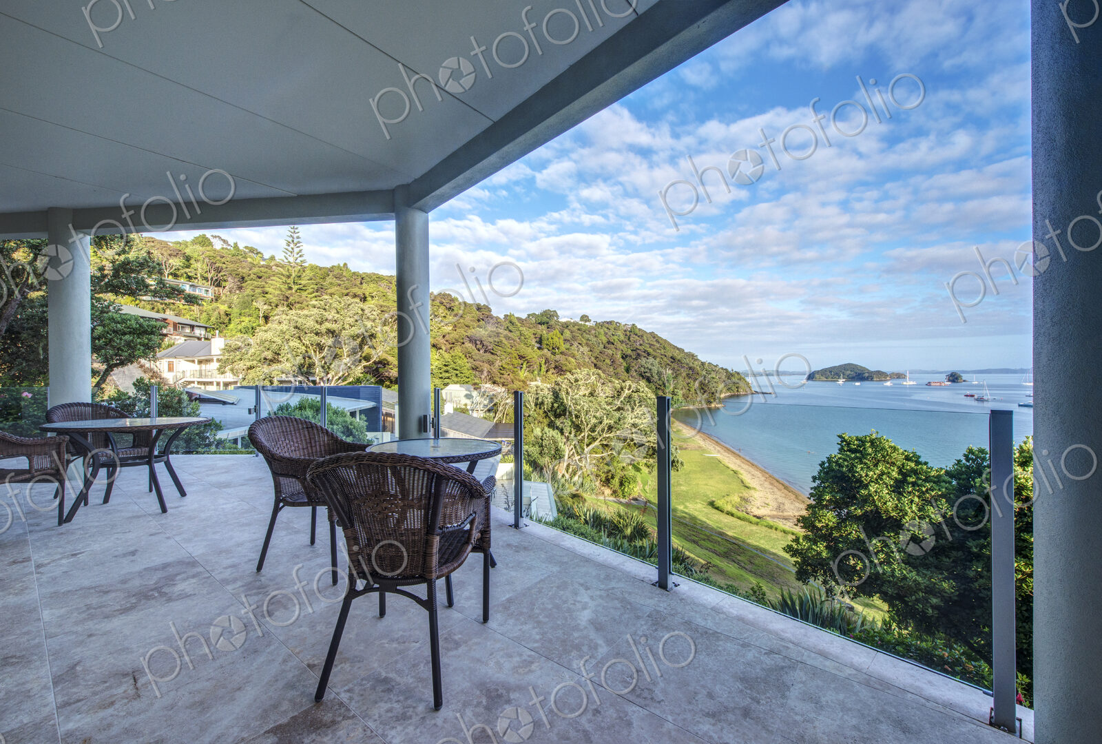 Table and chairs on balcony overlooking Bay of Islands, Paihia, New Zealand