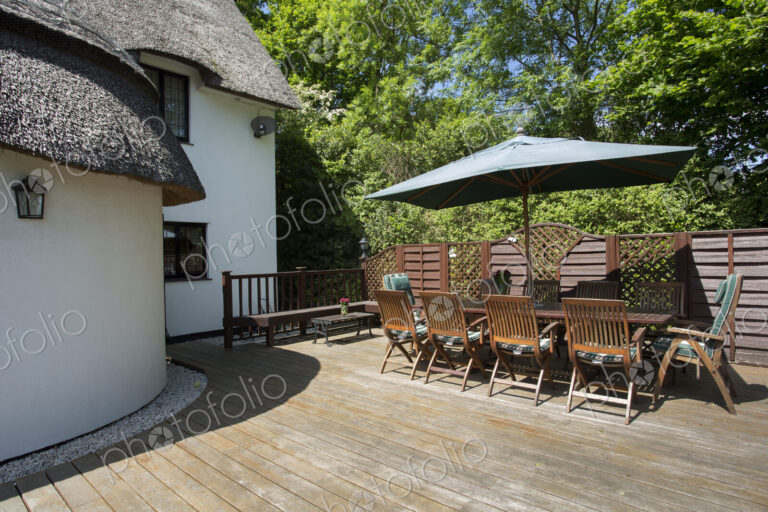 Table and chairs on cottage patio