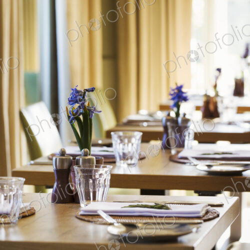 Table settings in the dining room at at boutique hotel in Gloucestershire. Table settings in the dining room at at boutique hotel in Gloucestershire.