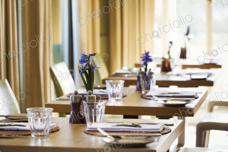 Table settings in the dining room at at boutique hotel in Gloucestershire.