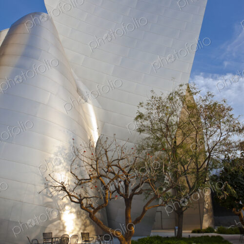 Tables and Chairs Outside of a Futuristic Building
