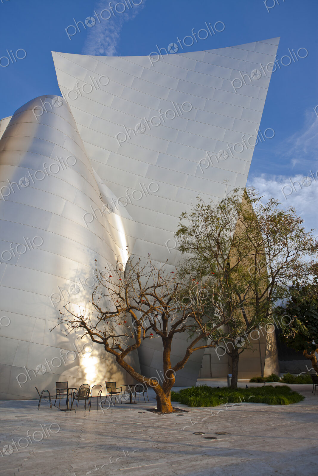 Tables and Chairs Outside of a Futuristic Building